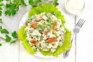 Image showing Salad of salmon and avocado with mayonnaise on board top