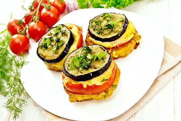 Image showing Appetizer of aubergines and cheese in plate on light board