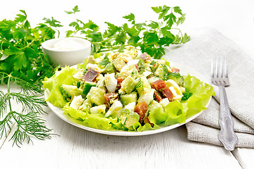 Image showing Salad of salmon and avocado on light board