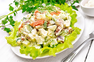 Image showing Salad of salmon and avocado with mayonnaise on table