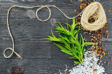 Image showing Tarragon leaves with twine on black board