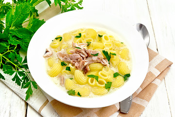 Image showing Soup creamy of chicken and pasta in plate on wooden board