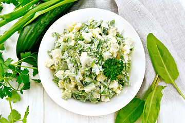 Image showing Salad with potatoes and sorrel on light board top