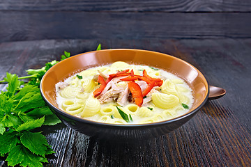 Image showing Soup creamy of chicken and pasta with pepper in plate on table