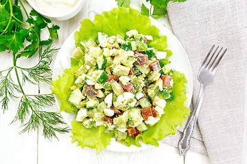 Image showing Salad of salmon and avocado on board top