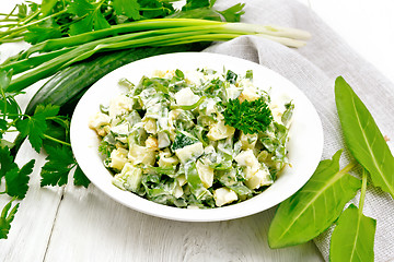 Image showing Salad with potatoes and sorrel on wooden table