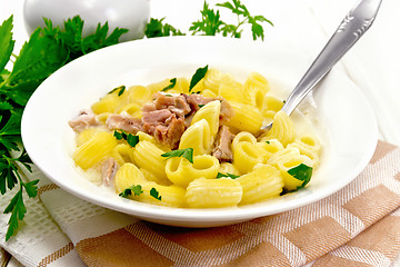 Image showing Soup creamy of chicken and pasta in plate on napkin