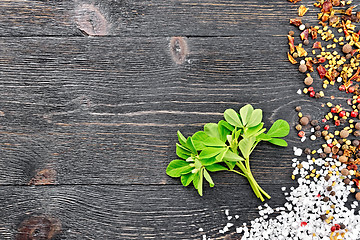 Image showing Fenugreek leaves with spices on black board