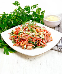 Image showing Salad of sausage and spicy carrots with mayonnaise on table