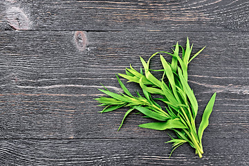 Image showing Tarragon leaves on black board