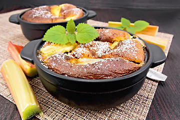 Image showing Klafuti with rhubarb and mint in brazier on wooden board