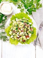 Image showing Salad of salmon and avocado on light board top