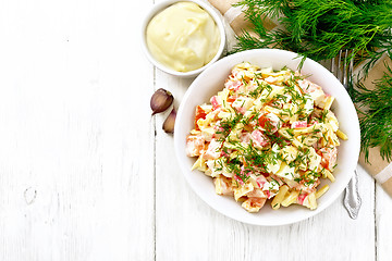 Image showing Salad of surimi and eggs with mayonnaise on board top