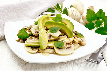 Image showing Salad of avocado and champignons on table