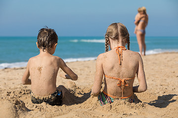Image showing Happy children playing on the beach at the day time.