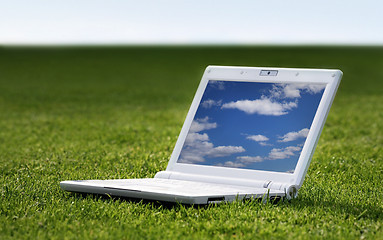 Image showing white laptop in nature