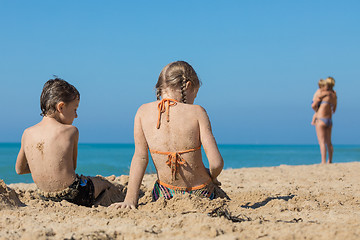 Image showing Happy children playing on the beach at the day time.