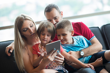 Image showing happy young couple spending time with kids