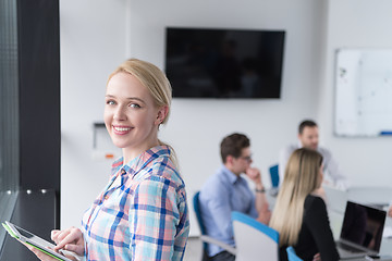 Image showing Pretty Businesswoman Using Tablet In Office Building by window