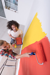 Image showing couple painting interior wall