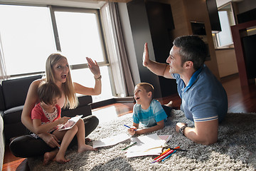 Image showing young couple spending time with kids