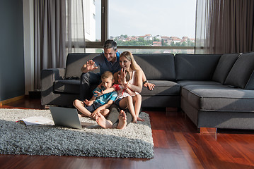 Image showing Family Playing Together with laptop computer