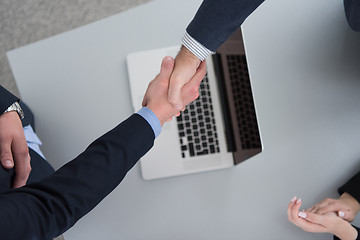 Image showing cloasing the deal in modern office interior top view