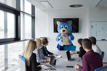 Image showing boss dresed as bear having fun with business people in trendy of