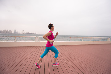 Image showing woman running on the promenade