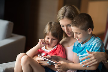 Image showing Young Family Using A Tablet To Make Future Plans