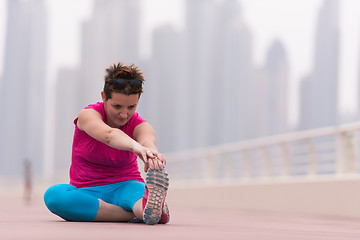 Image showing woman stretching and warming up