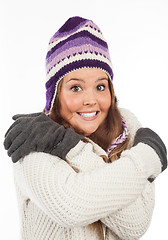 Image showing Face of pretty woman with gloves and knitted winter cap  with smile