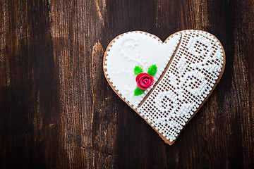 Image showing Gingerbread heart cookie on wooden background