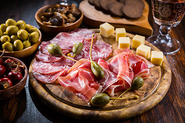 Image showing Serrano ham platter with variation of appetizers