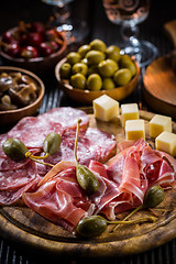 Image showing Serrano ham platter with variation of appetizers