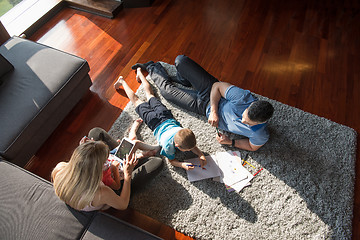 Image showing young couple spending time with kids top view