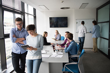 Image showing Two Business People Working With Tablet in office