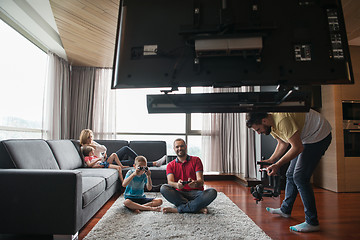 Image showing Happy family playing a video game