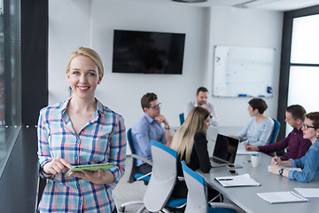 Image showing Pretty Businesswoman Using Tablet In Office Building by window