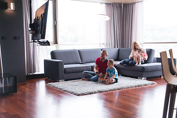 Image showing Happy family playing a video game