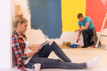 Image showing couple doing home renovations