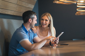 Image showing couple using tablet at home