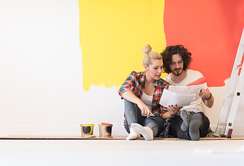 Image showing Happy young couple relaxing after painting