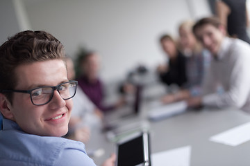 Image showing Businessman using tablet in modern office