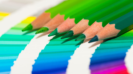 Image showing green colored pencils and color chart of all colors