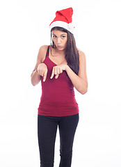 Image showing Happy christmas woman pointing