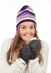 Image showing Face of pretty woman with gloves and knitted winter cap  with smile