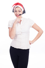 Image showing Pretty phone operator in Santa hat isolated over white