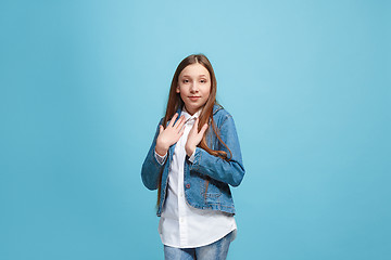 Image showing Young serious thoughtful teen girl. Doubt concept.