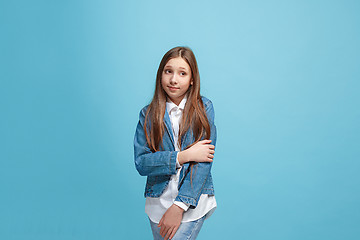 Image showing Young serious thoughtful teen girl. Doubt concept.